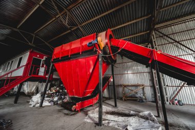 Conveyor belt for transporting garbage inside drum filter at modern recycling plant