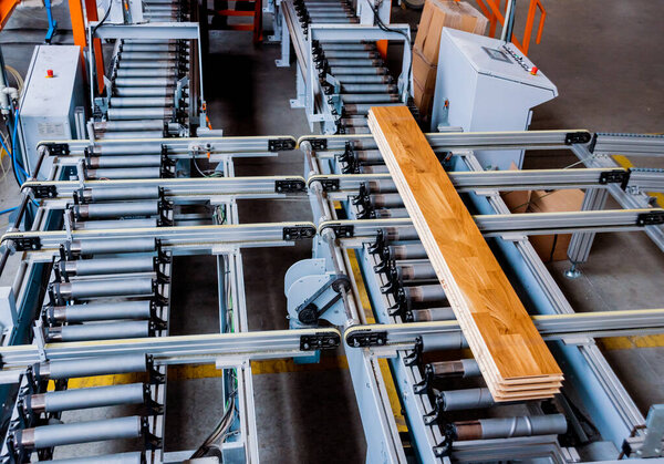 Production line of wooden floor factory, industrial background