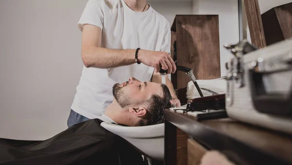 Young Man Trendy Haircut Barber Shop Barber Washes Customer Head — Stock Photo, Image