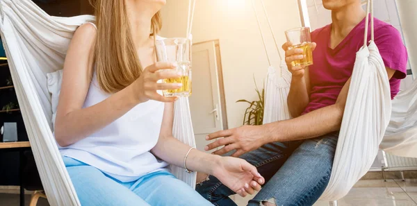 Cheerful couple in the pub. Drinking beer, talking, having fun. Meeting after work