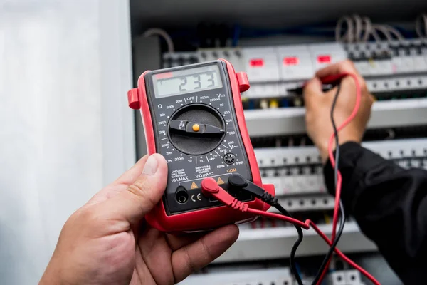 close up of electrical measurements with multimeter tester
