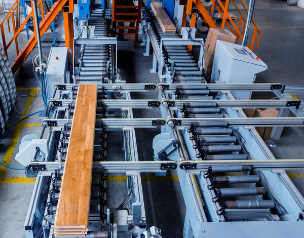 Production line of wooden floor factory, industrial background
