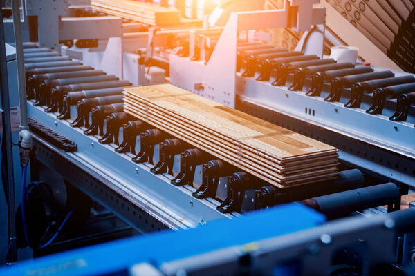 Production line of wooden floor factory, industrial background