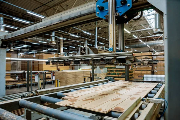 Production line of wooden floor factory, industrial background