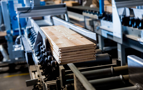 Production line of wooden floor factory, industrial background