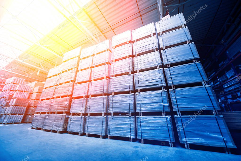 Warehouse industrial company, crates stacked on shelves