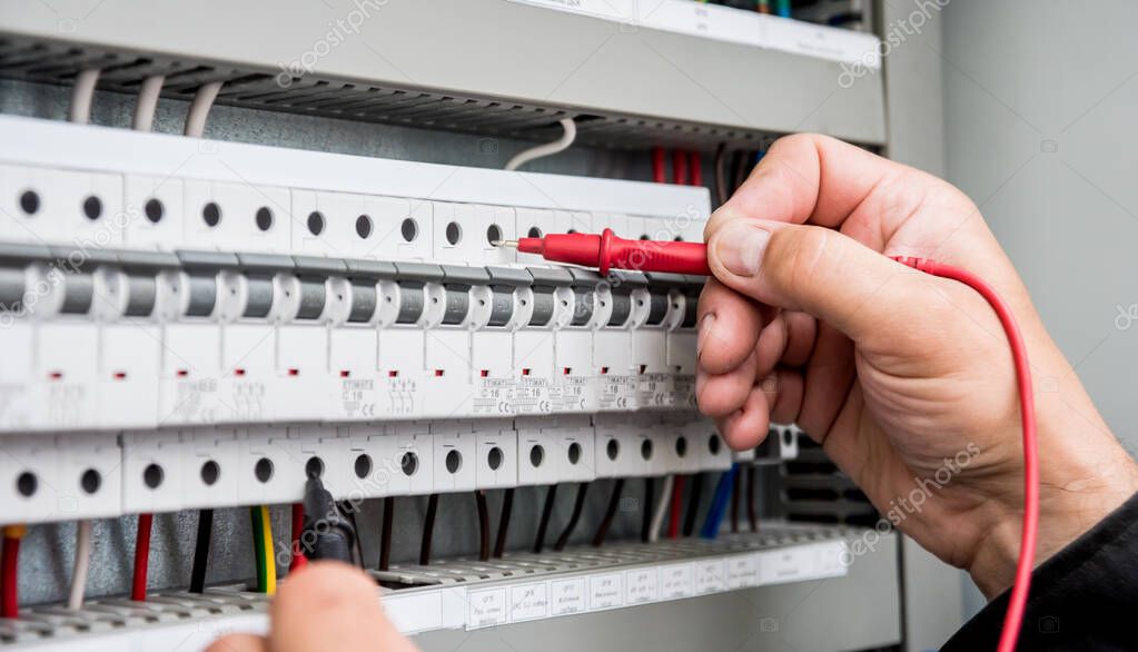 close up of electrical measurements with multimeter tester