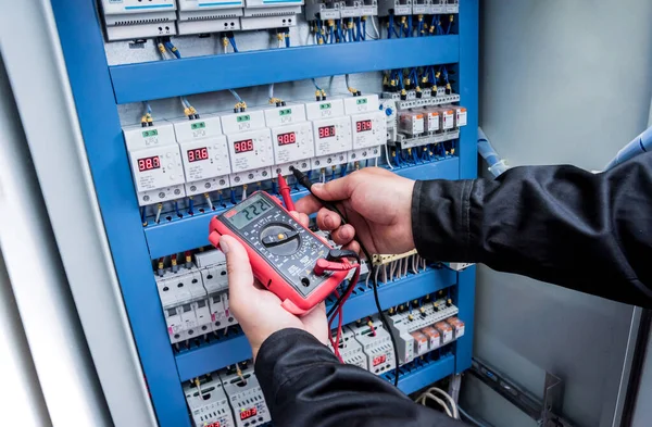 close up of electrical measurements with multimeter tester