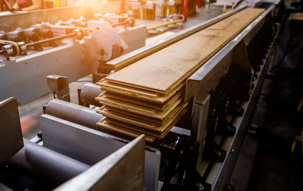 Production line of wooden floor factory, industrial background