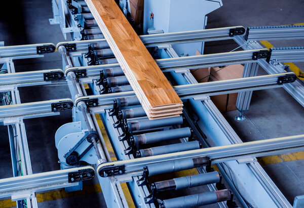 Production line of wooden floor factory, industrial background