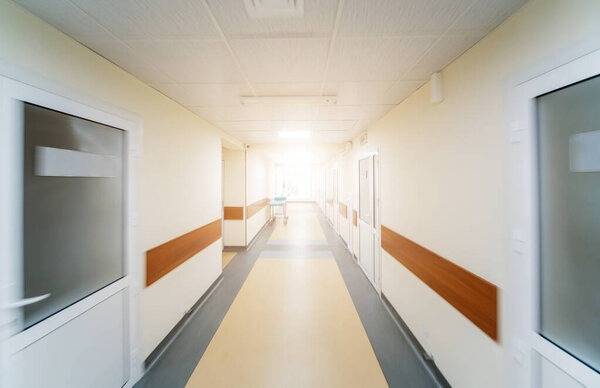 Empty long corridor in the modern clinic, medical background