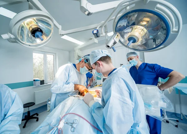 Spinal surgery. Group of surgeons in operating room with surgery equipment. Laminectomy — 스톡 사진
