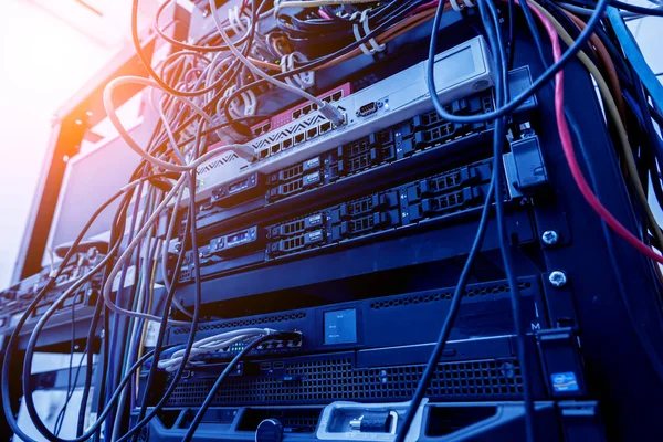 Server room with computers for internet. Network cables connected to switches.