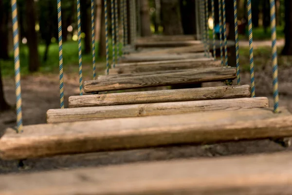 Bridge at the rope park in a forest. Adventure summer park. — Stock Photo, Image