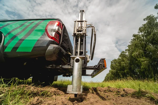 Soil examination. Collecting black soil on the field for examination