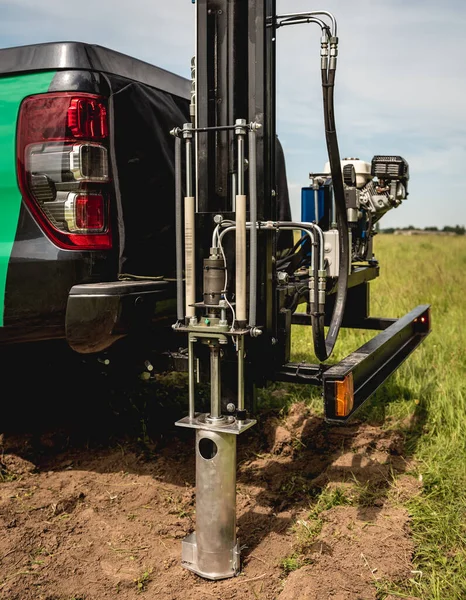 Soil examination. Collecting black soil on the field for examination