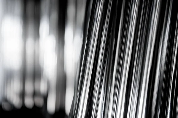 Abstrakter Hintergrund von auf einer Palette gestapelten Stahlrohren — Stockfoto