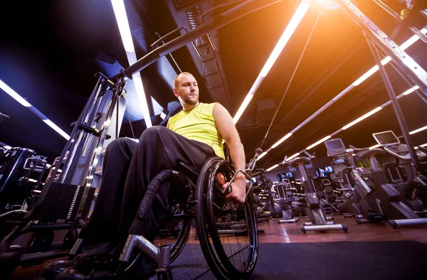 Disabled man training in the gym of rehabilitation center