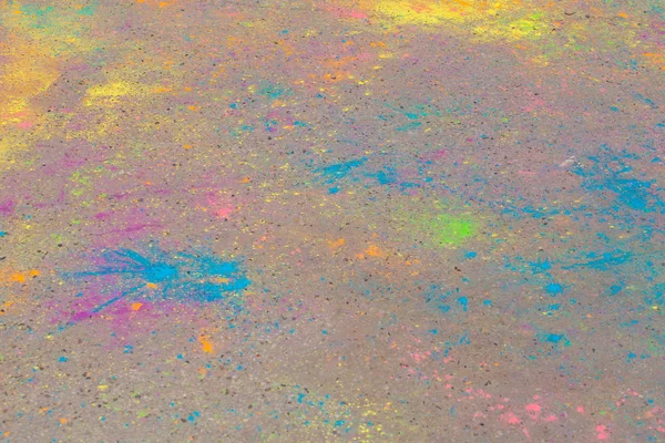 Achtergrond van kleurrijke Holi poeder op de grond — Stockfoto