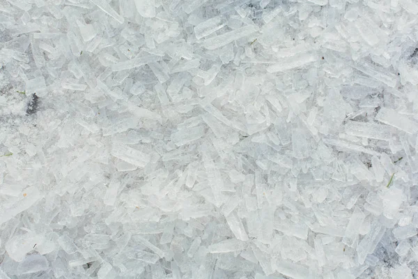 Amazing abstract broken ice crystals texture. Clear melting ice background. Copy space.