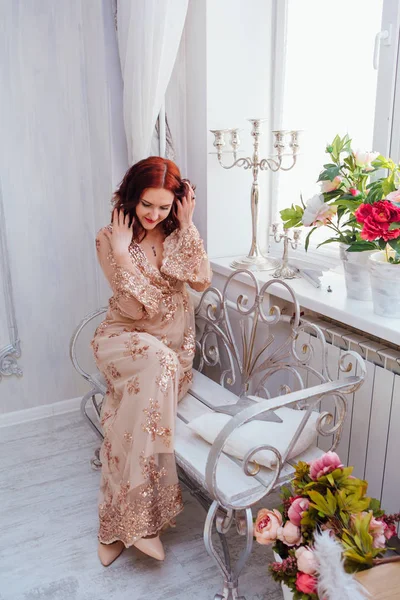 Beautiful Young Woman Red Hair Decorated Indoor Studio Flowers Sitting — Stock Photo, Image