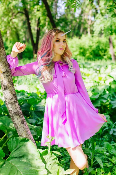 Fairy girl unicorn with pink hair in summer forest — Stock Photo, Image