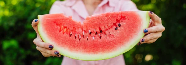 Banner with woman's hands holding fresh watermelon — Stock Photo, Image