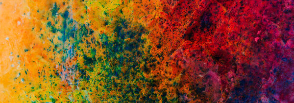 Banner background of colorful Holi powder on the snow