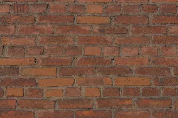 Фон из оранжевой и коричневой кирпичной стены — стоковое фото