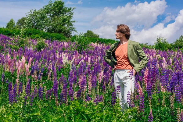 Tall Handsome Man Green Jacket Standing Lupine Flowers Field Enjoing — Stock Photo, Image