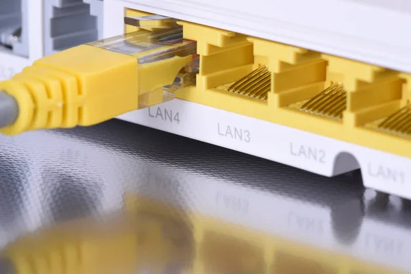 Network router with ethernet cable close up