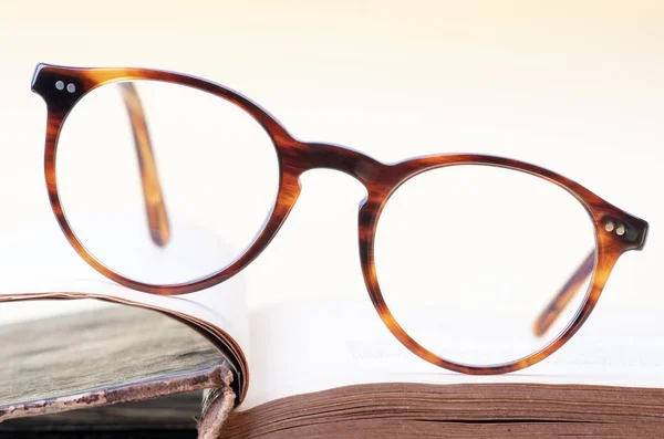 Closeup Reading Glasses Opened Book — Stock Photo, Image