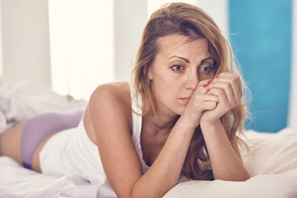 Woman worries about something in the morning in the bed — Stock Photo, Image