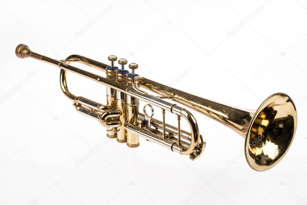 Old trumpet on an isolated studio background