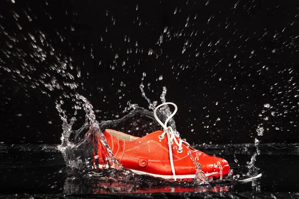 Red Shoe In The Water