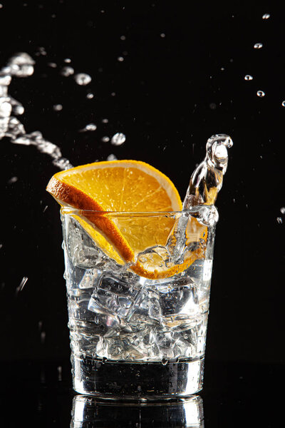 Glass, Orange, Ice And Splashes