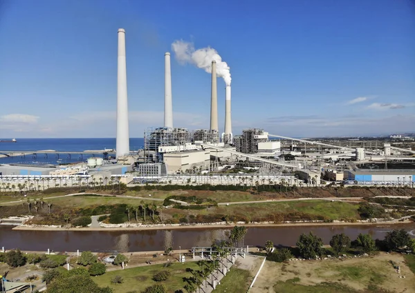 Public Park Nahal Hadera on the left bank of the river Hadera and on the right bank a thermal power station