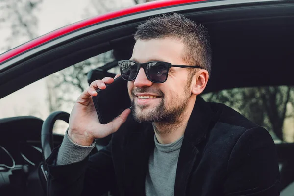 Young Handsome Man Using Phone Sitting Car — стоковое фото