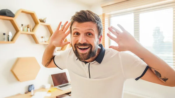 handsome bearded man with facial expression gesturing with his hands