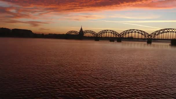 Riga Iron Railway bridge over River Daugava at sunrise — Stock Video