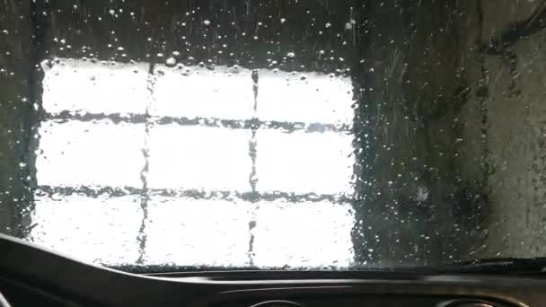 Automatic car wash seen from inside of a vehicle — Stock Video