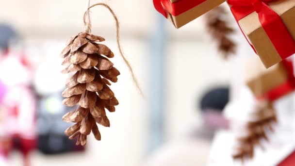 Hanging pine cone and presents — Stock Video