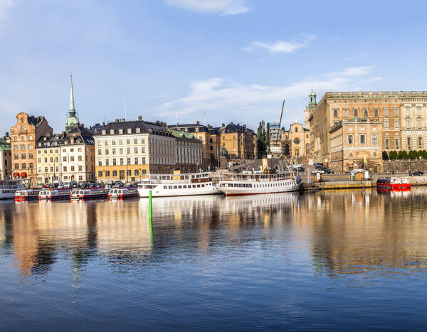 Stockholm daylight skyline panorama of Gamla Stan with white ships