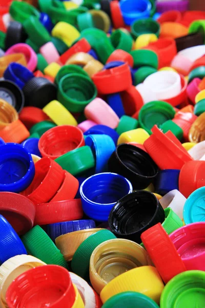 プラスチックキャップのテクスチャをリサイクル産業の背景として — ストック写真