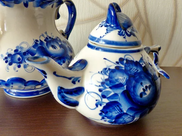 Teapots. Things in Russian traditional Gzhel style. Gzhel - Russian folk craft of ceramics and production porcelain and a kind of Russian folk painting. Closeup. Home tableware
