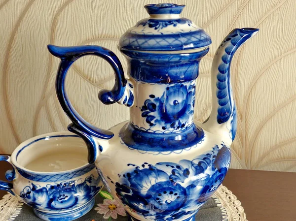 The big teapot in Russian traditional Gzhel style. Home tableware. Closeup. Gzhel - Russian folk craft of ceramics and production porcelain and a kind of Russian folk painting.