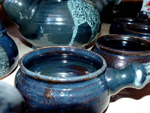 Ceramic coffee service. Latgalian ceramics. Folk craft Latvia. Traditionally, the products are painted with restrained, earthy shades. Selective focus.