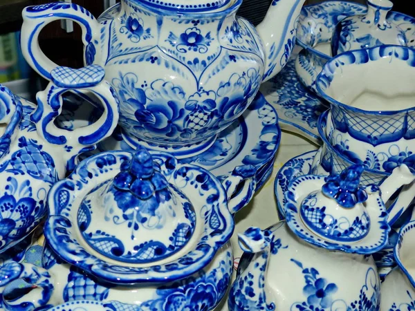 Home tableware in Russian traditional Gzhel style. Closeup. Gzhel - Russian folk craft of ceramics and production porcelain and a kind of Russian folk painting.