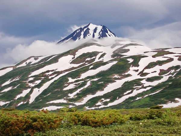 One of the active volcanoes of Kamchatka. Volcanoes of Kamchatka are fascinating. Their mysteriousness attracts many tourists from all countries. There are more than 25 volcanoes in Kamchatka