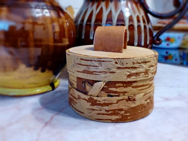 Tuesok - a small birch-bark box with lid. For storage of loose products. Closeup. Folk craft Russia. Retro.
